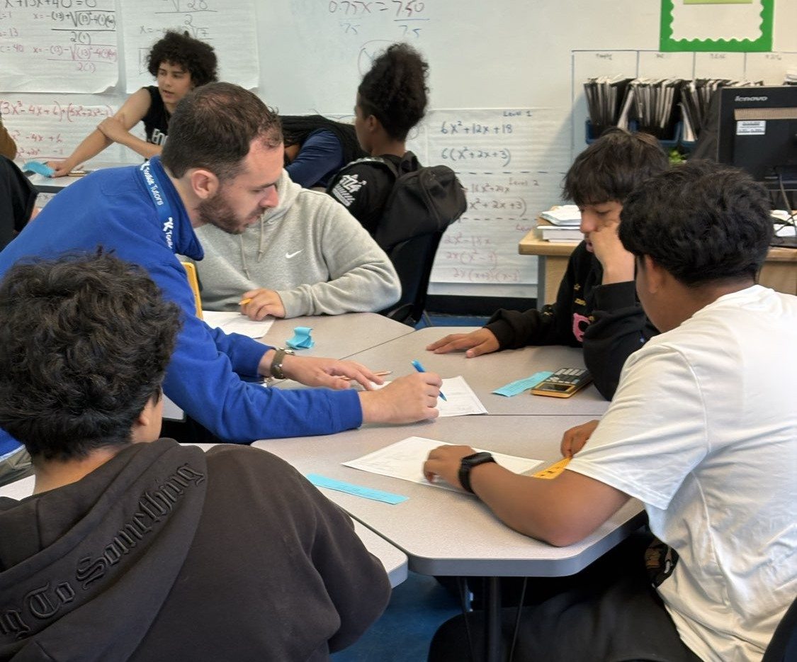 Toolkit Tutors tutor working with a small group of students