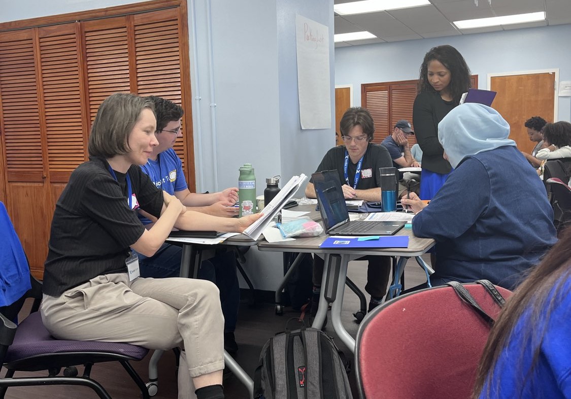 Toolkit tutors receiving training in the REWARDS literacy program